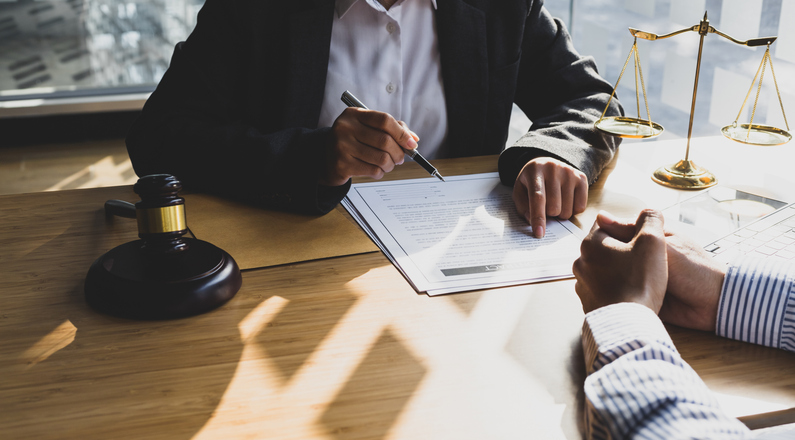 Lawyer meeting with client - What is a lien on a personal injury case?