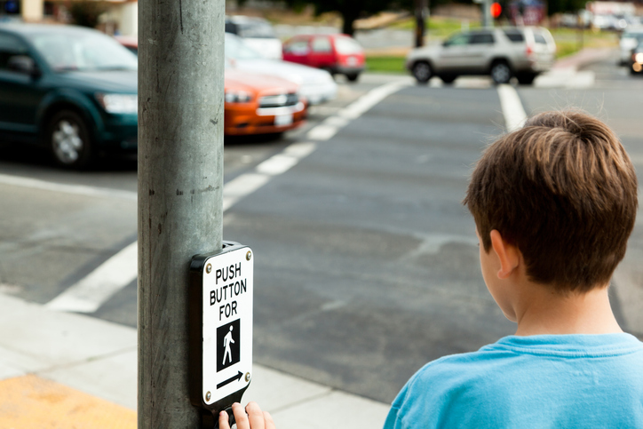 Child pushing pedestrian walk sign button while waiting to cross the street - When is a pedestrian at fault for a car accident in SC?